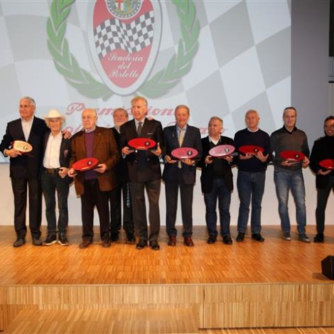 Premiazione dei "Campioni Alfa Romeo", Museo Storico di Arese, 23 febbraio 2019: da sinistra: Gian Luigi Picchi, Andrea De Adamich, Arturo Merzario, Carlo Facetti, Marco Cajani, Gianni Giudici, Mauro Pregliasco, Bruno Giacomelli, Giorgio Francia, Fabrizio Giovanardi, Alex Caffi e Andrea Cajani